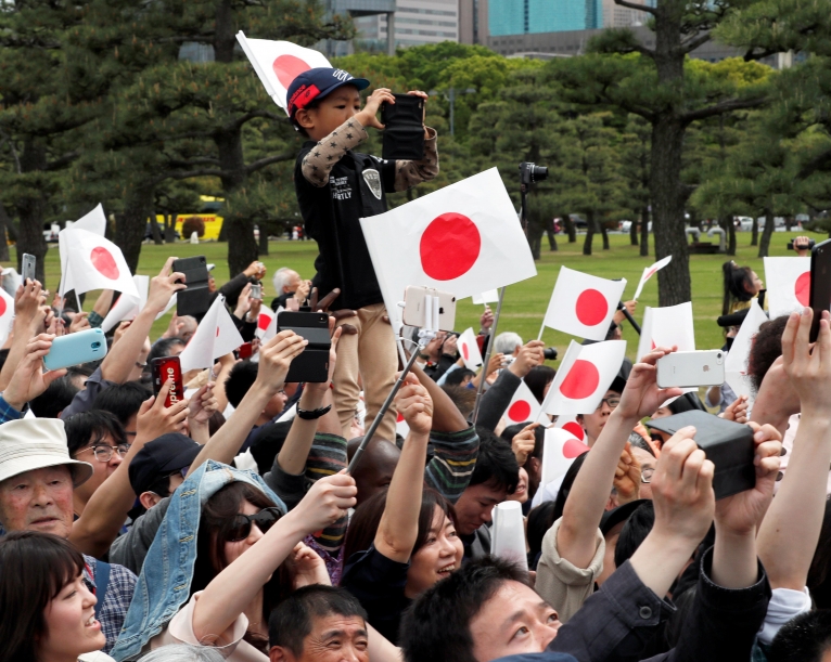 Japan's Emperor Naruhito pledges to work as symbol of the people